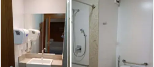 Banheiro hospitalar acessível reformado, com bancada de granito claro, boxes com barras de apoio e revestimento novo